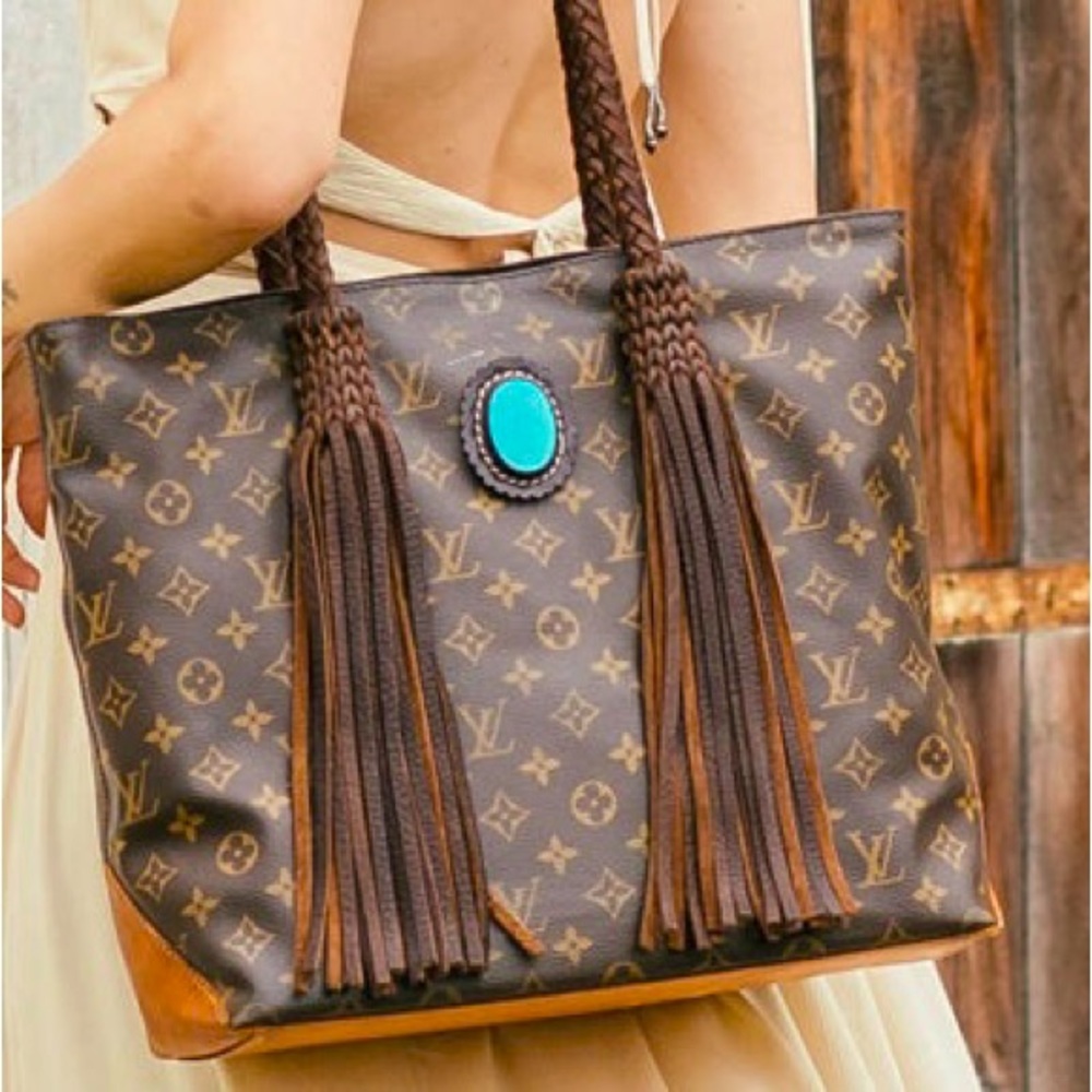 Louis Vuitton Designer large bag with a twist.